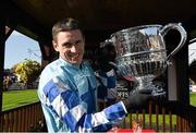 26 April 2016; Paddy Brennan celebrates with the with the Blessington Cup after winning the BoyleSports Champion Steeplechase on God's Own. Punchestown, Co. Kildare. Photo by Sportsfile