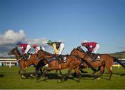 26 April 2016; A general view of the runners and riders first time around during the Growise Champion Novice Steeplechase. Punchestown, Co. Kildare. Photo by Sportsfile