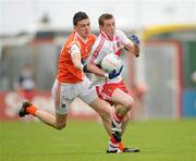 16 May 2010; Aaron Devlin, Derry, in action against Conor Gough, Armagh. ESB Ulster GAA Football Minor Championship, Derry v Armagh, Celtic Park, Derry. Photo by Sportsfile