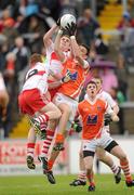 16 May 2010; Conor Gough, Armagh, in action against Ryan Bell and Aaron Devlin, left, Derry. ESB Ulster GAA Football Minor Championship, Derry v Armagh, Celtic Park, Derry. Photo by Sportsfile