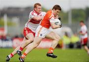 16 May 2010; Charlie Vernon, Armagh, in action against Fergal Doherty, Derry. Ulster GAA Football Senior Championship - Preliminary Round, Derry v Armagh, Celtic Park, Derry. Photo by Sportsfile