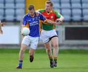 16 May 2010; Paul Earls, Wicklow, is tackled by  Carlow's John Hayden before going on to score the first goal of the game. Leinster GAA Football Senior Championship Preliminary Round, Wicklow v Carlow, O'Moore Park, Portlaoise, Co. Laoise. Picture credit: Matt Browne / SPORTSFILE