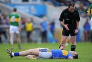 16 May 2010; Referee David Coldrick speaks to Barry Grogan, Tipperary, as he awaits medical attention after receiving a slight knock during play. Munster GAA Football Senior Championship Quarter-Final, Kerry v Tipperary, Semple Stadium, Thurles, Co. Tipperary. Picture credit: Brendan Moran / SPORTSFILE