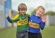 16 May 2010; Tommy Maher, from Thurles, Co. Tipperary, wearing a Kerry jersey, and his cousin Tomas Ashe, from Annascaul, Co. Kerry, wearing a Tipperary jersey, ahead of the match. Munster GAA Football Senior Championship Quarter-Final, Kerry v Tipperary, Semple Stadium, Thurles, Co. Tipperary. Picture credit: Stephen McCarthy / SPORTSFILE