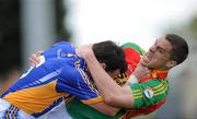 16 May 2010; Carlow's Brendan Murphy and Wicklow's Brian McGrath tussel during the game. Leinster GAA Football Senior Championship Preliminary Round, Wicklow v Carlow, O'Moore Park, Portlaoise, Co. Laoise. Picture credit: Matt Browne / SPORTSFILE