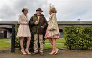 28 April 2016; Grace Sheridan, left, from Monaghan City, and Sheena Kerr, from Armagh City, share a laugh with longtime Punchestown punter John Molloy from Newtown Mt. Kennedy, Co. Wicklow ahead of the races. Punchestown, Co. Kildare. Picture credit: Cody Glenn / SPORTSFILE