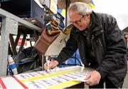 29 April 2016; Bookmaker Rickey Gernon, from Donlavin, Co. Wicklow, prepares his pitch ahead of Day 4 at Punchestown Festival. Punchestown, Co. Kildare. Picture credit: Seb Daly / SPORTSFILE