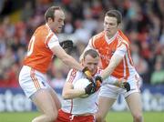 16 May 2010; Paddy Bradley, Derry, in action against Malachy Mackin and Brendan Donaghy, Armagh. Ulster GAA Football Senior Championship - Preliminary Round, Derry v Armagh, Celtic Park, Derry. Picture credit: Oliver McVeigh / SPORTSFILE