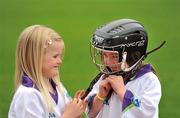 18 May 2010; Grainne Cahill, left, helps place a helmet on her cousin Aisling Cahill, both age 6, from Co. Cavan, at the Vhi GAA Cúl Camps Ambassador Launch 2010. The Vhi GAA Cúl Camps are the largest children’s summer activity in the country with over 85,000 children taking part in over 1,000 camps around Ireland and overseas. Croke Park, Dublin. Picture credit: David Maher / SPORTSFILE