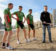 20 May 2010; Team manager Kurt Bogaerts practices his hurling skills with the Irish members of the An Post Sean Kelly team who will be in action at this weekend's Rás starting Sunday 23rd May. Pictured, from left is, David O'Loughlin, Connor McConvey and Mark Cassidy. Picture credit: Pat Murphy / SPORTSFILE