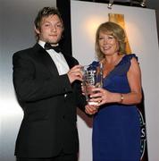 20 May 2010; Jamie Smith, winner of the Ulster Young Player of the Year award, sponsored by Vodafone, is presented by Pauline Quigley, Head of Vodafone Northern Ireland. Ulster Rugby Awards, La Mon Hotel, Belfast. Picture credit: John Dickson / SPORTSFILE