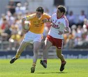 23 May 2010; John Carron, Antrim, in action against Ryan Devlin, Tyrone. ESB Ulster GAA Football Minor Championship, Antrim v Tyrone, Casement Park, Belfast, Co. Antrim. Picture credit: Oliver McVeigh / SPORTSFILE