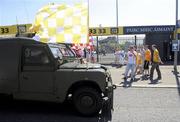 23 May 2010; A local owner of a retired army landrover adorns the Antrim and Tyrone flags as it drives past Casement Park. Ulster GAA Football Senior Championship Quarter-Final, Antrim v Tyrone, Casement Park, Belfast, Co. Antrim. Picture credit: Oliver McVeigh / SPORTSFILE