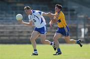 23 May 2010; Gary Hurney, Waterford, in action against Gordan Kelly, Clare. Munster GAA Football Senior Championship Quarter-Final, Waterford v Clare, Fraher Field, Dungarvan, Co. Waterford. Picture credit: Diarmuid Greene / SPORTSFILE