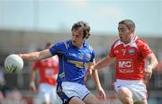 23 May 2010; Kevin Mulligan, Longford, in action against John O'Brien, Louth. Leinster GAA Football Senior Championship Preliminary Round, Louth v Longford, O'Moore Park, Portlaoise, Co. Laois. Picture credit: Brian Lawless / SPORTSFILE