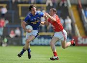 23 May 2010; Kevin Mulligan, Longford, in action against John O'Brien, Louth. Leinster GAA Football Senior Championship Preliminary Round, Louth v Longford, O'Moore Park, Portlaoise, Co. Laois. Picture credit: Brian Lawless / SPORTSFILE