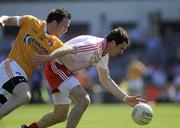 23 May 2010; Justin McMahon, Tyrone, in action against Michael McCann, Antrim. Ulster GAA Football Senior Championship Quarter-Final, Antrim v Tyrone, Casement Park, Belfast, Co. Antrim. Picture credit: Oliver McVeigh / SPORTSFILE