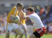 23 May 2010; Paddy Cunningham, Antrim, in action against Dermot Carlin, Tyrone. Ulster GAA Football Senior Championship Quarter-Final, Antrim v Tyrone, Casement Park, Belfast, Co. Antrim. Picture credit: Oliver McVeigh / SPORTSFILE