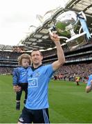 24 April 2016; Dublin's Denis Bastick with son Aiden following his side's victory. Allianz Football League Division 1 Final, Dublin v Kerry. Croke Park, Dublin.  Picture credit: Ramsey Cardy / SPORTSFILE