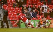 29 April 2016; Andrew Conway, Munster, scores his side's third try despite the efforts of Jamie Ritchie, Edinburgh. Guinness PRO12 Round 21, Munster v Edinburgh. Irish Independent Park, Cork. Picture credit: Diarmuid Greene / SPORTSFILE