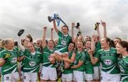 30 April 2016; Limerick captain Dymphna O'Brien lifts the cup as her team-mates celebrate. Lidl Ladies Football National League Division 4 Final, Antrim v Limerick, Clane, Co. Kildare. Picture credit: Matt Browne / SPORTSFILE