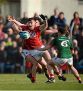 30 April 2016; Peter Kelleher, Cork, in action against Michael Hall and Séamus Cunniffe, behind, Mayo. EirGrid GAA Football Under 21 All-Ireland Championship Final, Cork v Mayo. Cusack Park, Ennis, Co. Clare. Picture credit: Piaras Ó Mídheach / SPORTSFILE
