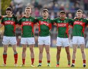 30 April 2016; Mayo players stand, with arms around each other, to sing the national anthem, before the start of the match. EirGrid GAA Football Under 21 All-Ireland Championship Final, Cork v Mayo, Cusack Park, Ennis, Co. Clare. Picture credit: Seb Daly / SPORTSFILE