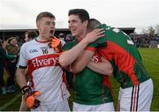 April 2016; Mayo's, from left, Scott Kilker, Conor Loftus and Séamus Cunniffe celebrate after the game. EirGrid GAA Football Under 21 All-Ireland Championship Final, Cork v Mayo. Cusack Park, Ennis, Co. Clare. Picture credit: Piaras Ó Mídheach / SPORTSFILE