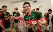 April 2016; Mayo's Conor Loftus celebrates with the cup in the dressing room after the game. EirGrid GAA Football Under 21 All-Ireland Championship Final, Cork v Mayo. Cusack Park, Ennis, Co. Clare. Picture credit: Piaras Ó Mídheach / SPORTSFILE
