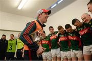 April 2016; Mayo manager Michael Solan celebrates with the cup in the dressing room after the game. EirGrid GAA Football Under 21 All-Ireland Championship Final, Cork v Mayo. Cusack Park, Ennis, Co. Clare. Picture credit: Piaras Ó Mídheach / SPORTSFILE