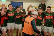 April 2016; Mayo players celebrate with their manager Michael Solan in the dressing room after the game. EirGrid GAA Football Under 21 All-Ireland Championship Final, Cork v Mayo. Cusack Park, Ennis, Co. Clare. Picture credit: Piaras Ó Mídheach / SPORTSFILE