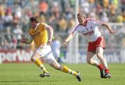 23 May 2010; Kevin McGourty, Antrim, in action against Kevin Hughes, Tyrone. Ulster GAA Football Senior Championship Quarter-Final, Antrim v Tyrone, Casement Park, Belfast, Co. Antrim. Picture credit: Oliver McVeigh / SPORTSFILE