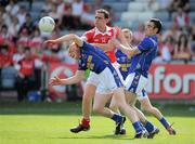 23 May 2010; Shane Lennon, Louth, in action against Dermot Brady, left, and Diarmuid Masterson, Longford. Leinster GAA Football Senior Championship Preliminary Round, Louth v Longford, O'Moore Park, Portlaoise, Co. Laois. Picture credit: Brian Lawless / SPORTSFILE
