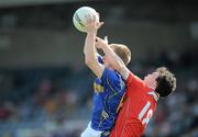 23 May 2010; Declan Reilly, Longford, in action against Colm Judge, Louth. Leinster GAA Football Senior Championship Preliminary Round, Louth v Longford, O'Moore Park, Portlaoise, Co. Laois. Picture credit: Brian Lawless / SPORTSFILE