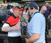 23 May 2010; Tyrone manager Mickey Harte gives a radio interview after the game. Ulster GAA Football Senior Championship Quarter-Final, Antrim v Tyrone, Casement Park, Belfast, Co. Antrim. Picture credit: Oliver McVeigh / SPORTSFILE