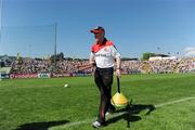 23 May 2010; Tyrone manager Mickey Harte gathering up the warm up equipment before the game. Ulster GAA Football Senior Championship Quarter-Final, Antrim v Tyrone, Casement Park, Belfast, Co. Antrim. Picture credit: Oliver McVeigh / SPORTSFILE