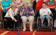 24 May 2010; The Minister for Tourism, Culture and Sport Mary Hanafin T.D. playing a game of Bocce with Margaret O’Brien, centre, Service User of the Sisters of Charity Disability Organisation, and Edward Palmer, Service User of the National Learning Network, Tullamore, Co. Offaly, at the launch of SPEAK Report: Evaluation of Work of Local Sports Partnerships, the evaluation mechanism that racks the activities of the Partnerships year on year. Among the many highlights were that 112,000 people participated in 744 directly delivered participation programmes and 3500 clubs were supported in the delivery of their sports activities. The Minister announced the Irish Sports Council's funding package for the national network of Sports Partnerships The 32 Partnerships have been allocated almost €6.3 million in funding in 2010 and this will be matched by revenue from other sources bringing the total invested in local participation initiatives through the Partnerships to more than €12.5 million in 2010. Tullamore Court, Tullamore, Co. Offaly. Picture credit: Brendan Moran / SPORTSFILE