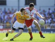 23 May 2010; Michael McCann, Antrim, in action against Justin McMahon, Tyrone. Ulster GAA Football Senior Championship Quarter-Final, Antrim v Tyrone, Casement Park, Belfast, Co. Antrim. Picture credit: Oliver McVeigh / SPORTSFILE