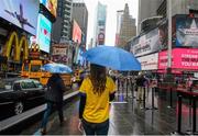 1 May 2016; Pauline May, originally from Boyle, Co. Roscommon, now living in New York, walks through Time Square ahead of the game. Connacht GAA Senior Football Championship, Round 1, New York v Roscommon, Gaelic Park, New York, USA. Picture credit: Daire Brennan / SPORTSFILE