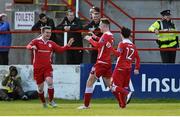 2 May 2016; Lorcan Shannon, left, Shelbourne, celebrates after scoring his side's first goal with team-mates Robert O'Reilly and Dylan Grimes, right. EA Sports Cup Quarter-Final, Shelbourne v Shamrock Rovers. Tolka Park, Dublin.  Photo by Sportsfile