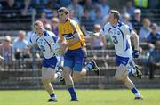 23 May 2010; Gary Brennan, Clare, in action against Shane Briggs, left, and Tomas O'Gorman, Waterford. Munster GAA Football Senior Championship Quarter-Final, Waterford v Clare, Fraher Field, Dungarvan, Co. Waterford. Picture credit: Diarmuid Greene / SPORTSFILE