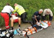 27 May 2010; Matthew Rowe, Wales National Team, left, and John Lynch, Kildare Murphy Surveys, receiving medical attention at the scene of a crash inside the opening 20km. Four riders Lars Pria, Arbö KTM-Gebrüder Weis, Matthew Rowe, Wales National Team, John Lynch, Kildare Murphy Surveys, and Bernard Twomey, Mayo Castlebar Western Edge, were taken to hospital by ambulance. FBD Insurance Ras, Stage 5, Tipperary - Seskin Hill. Picture credit: Stephen McCarthy / SPORTSFILE