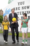 28 May 2010; Former Derry footballer Anthony Tohill with Aoife McDaid, Doire Colmcille GFC, left, and Ciaran Moore, Derrytrasna GFC, at the launch of Féile Peil na nÓg, sponsored by Coca Cola. Free Derry Corner, Derry City. Picture credit: Oliver McVeigh / SPORTSFILE