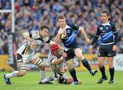 29 May 2010; Gordon D'Arcy, Leinster, gets away from the tackle of Ryan Jones, left, and Alun-Wyn Jones, Ospreys. Celtic League Grand Final, Leinster v Ospreys, RDS, Dublin. Picture credit: Brendan Moran / SPORTSFILE