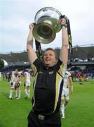 29 May 2010; Ospreys head coach Sean Holley celebrates with the Celtic League Trophy after the game. Celtic League Grand Final, Leinster v Ospreys, RDS, Ballsbridge, Dublin. Picture credit: Brendan Moran / SPORTSFILE