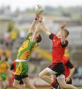 30 May 2010; Sean Boyle, Donegal, in action against Declan Turley, Down. ESB Ulster GAA Football Minor Championship Quarter-Final, Donegal v Down, Mac Cumhail Park, Ballybofey, Co. Donegal. Picture credit: Oliver McVeigh / SPORTSFILE