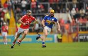 30 May 2010; Philip Austin, Tipperary, in action against Tadhg Healy, Cork. Munster GAA Hurling Intermediate Championship Quarter-Final, Cork v Tipperary, Pairc Ui Chaoimh, Cork. Picture credit: Ray McManus / SPORTSFILE