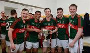 30 April 2016; Mayo players, from left, Michael Plunkett, Shairoze Akram, Brian Reape, Eddie Doran and Matthew Ruane, celebrate with the cup in the dressing room after the game. EirGrid GAA Football Under 21 All-Ireland Championship Final, Cork v Mayo. Cusack Park, Ennis, Co. Clare. Picture credit: Piaras Ó Mídheach / SPORTSFILE