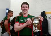 30 April 2016; Mayo's Conor Loftus celebrates with the cup in the dressing room after the game. EirGrid GAA Football Under 21 All-Ireland Championship Final, Cork v Mayo. Cusack Park, Ennis, Co. Clare. Picture credit: Piaras Ó Mídheach / SPORTSFILE