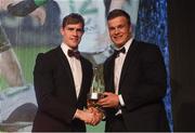4 May 2016; Leinster and Ireland's Josh van der Flier is presented with the Nevin Spence Young Player of the Year award by Andrew Trimble. Hilton by Double Tree, Ballsbridge, Dublin. Picture credit: Ramsey Cardy / SPORTSFILE